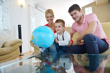 Image showing family have fun with globe