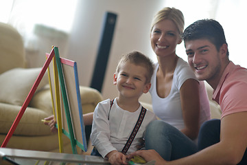 Image showing family drawing on school board at home