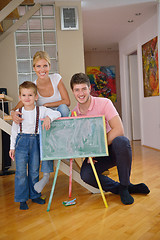 Image showing family drawing on school board at home