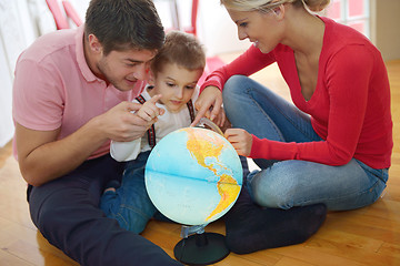 Image showing family have fun with globe