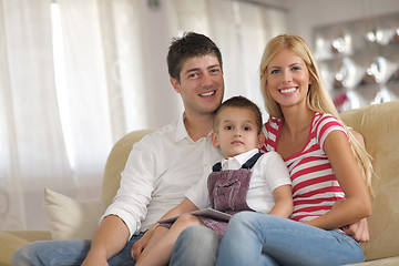 Image showing family at home using tablet computer