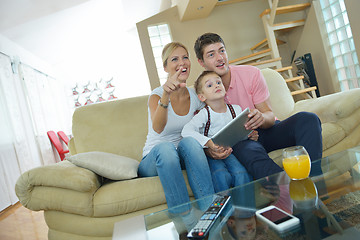 Image showing family at home using tablet computer