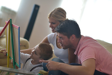 Image showing family drawing on school board at home