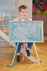 Image showing family drawing on school board at home