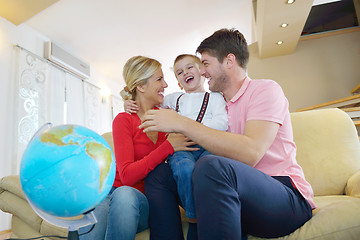 Image showing family have fun with globe