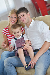 Image showing family at home using tablet computer