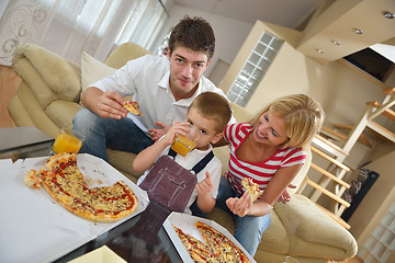 Image showing family eating pizza