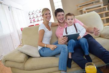 Image showing family at home using tablet computer