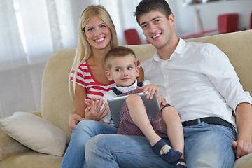 Image showing family at home using tablet computer