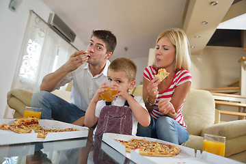 Image showing family eating pizza