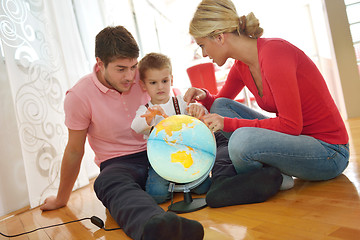 Image showing family have fun with globe