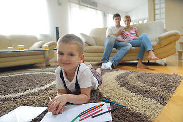 Image showing family drawing on school board at home