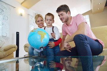 Image showing family have fun with globe