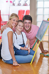 Image showing family drawing on school board at home