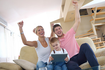 Image showing family at home using tablet computer