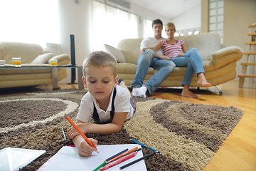 Image showing family drawing on school board at home