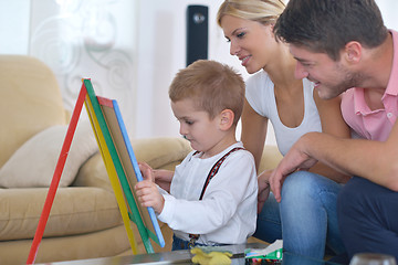 Image showing family drawing on school board at home