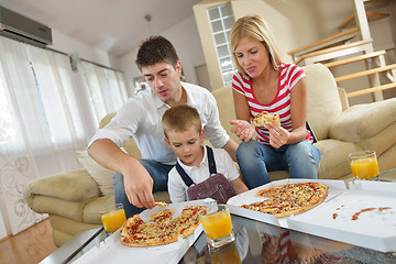 Image showing family eating pizza