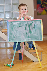 Image showing family drawing on school board at home