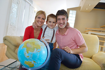 Image showing family have fun with globe