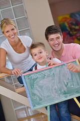 Image showing family drawing on school board at home