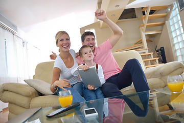 Image showing family at home using tablet computer