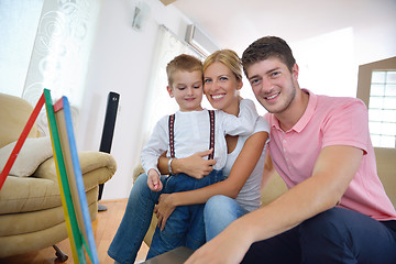 Image showing family drawing on school board at home