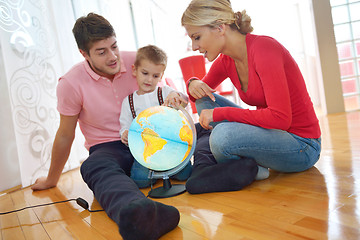 Image showing family have fun with globe