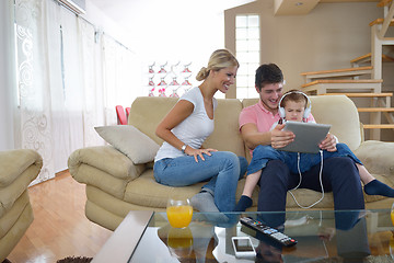 Image showing family at home using tablet computer