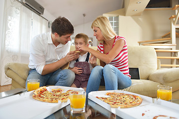 Image showing family eating pizza