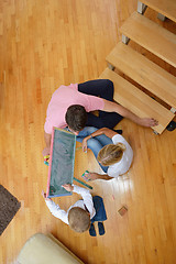 Image showing family drawing on school board at home