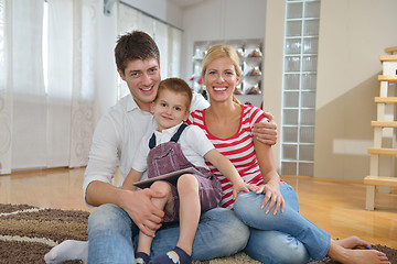 Image showing family at home using tablet computer