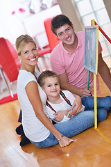 Image showing family drawing on school board at home