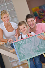 Image showing family drawing on school board at home