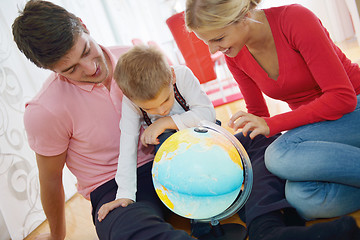 Image showing family have fun with globe