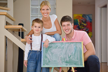 Image showing family drawing on school board at home