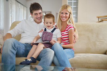 Image showing family at home using tablet computer