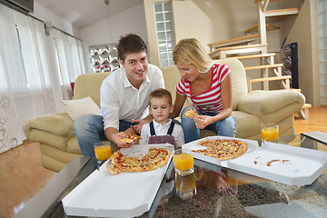 Image showing family eating pizza