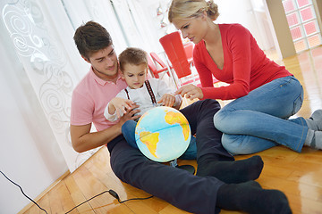 Image showing family have fun with globe