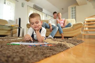 Image showing family at home using tablet computer