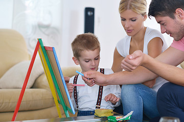 Image showing family drawing on school board at home