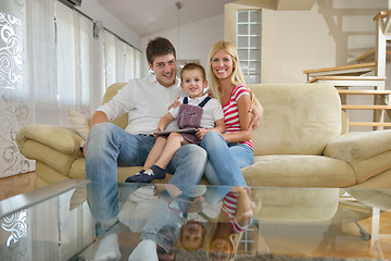 Image showing family at home using tablet computer