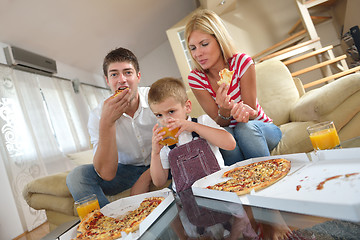 Image showing family eating pizza