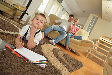 Image showing family drawing on school board at home