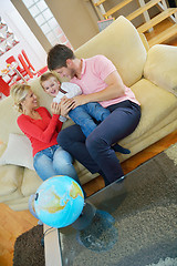 Image showing family have fun with globe