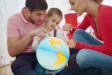 Image showing family have fun with globe