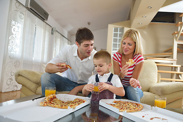 Image showing family eating pizza