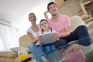 Image showing family at home using tablet computer