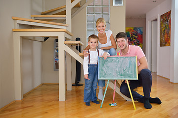 Image showing family drawing on school board at home