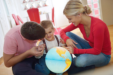 Image showing family have fun with globe